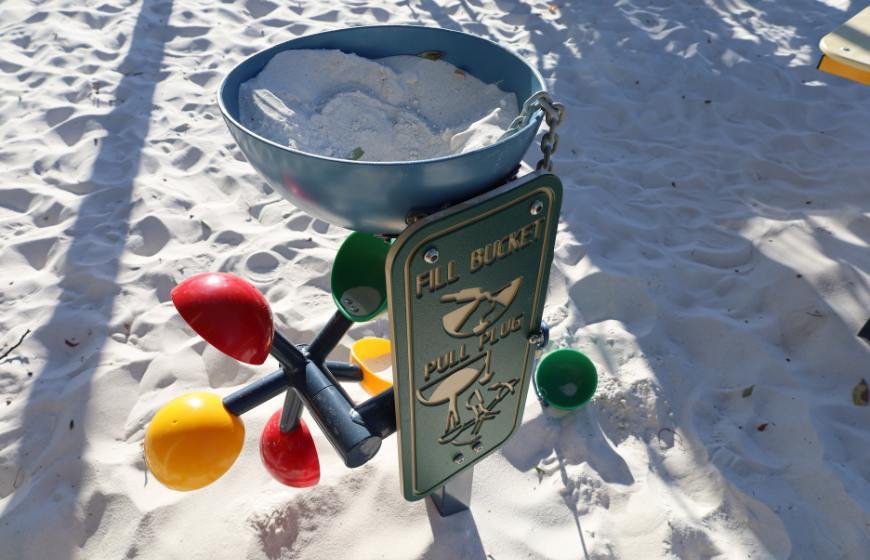 Childrens outdoor play bucket game full of sand pit sand