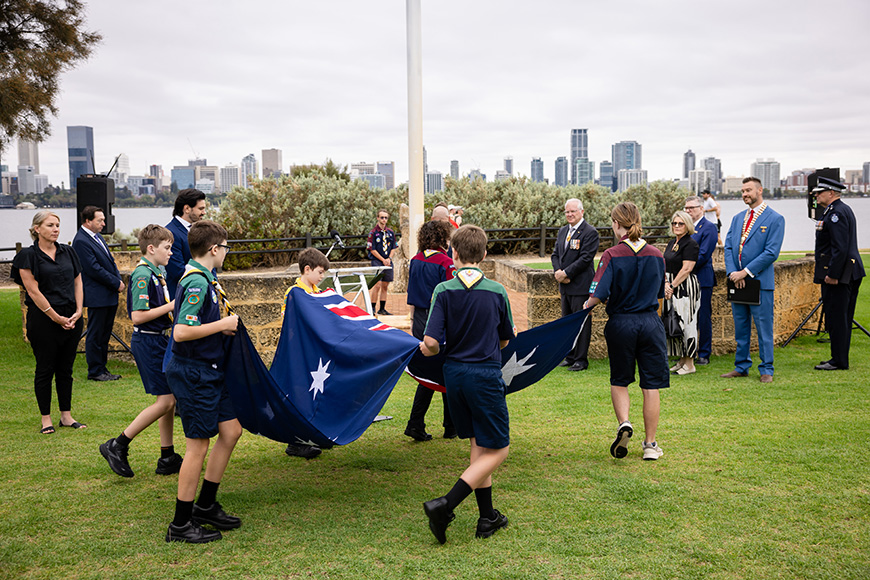 Young people carrying a large Australian flag