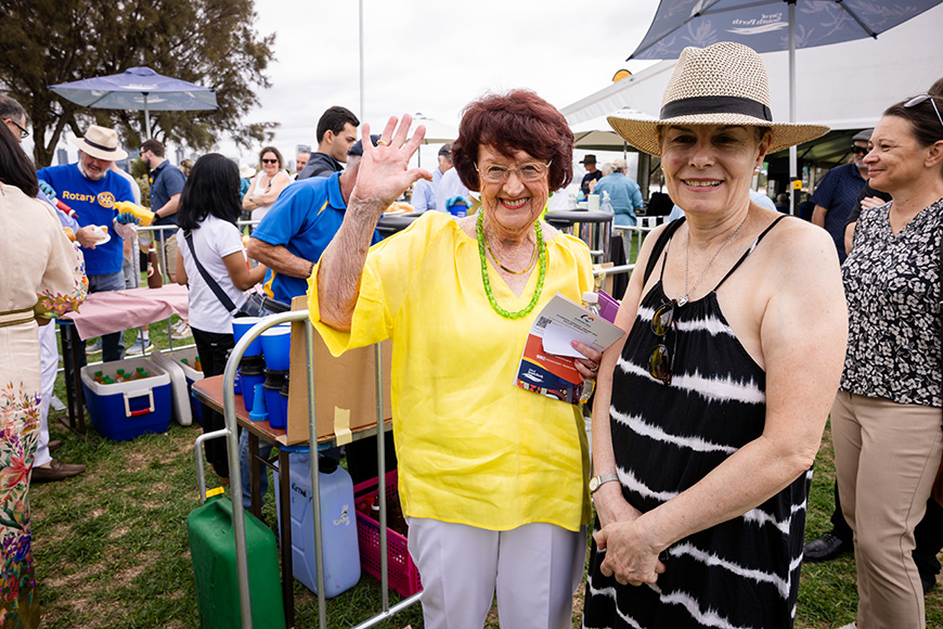 Two people smiling at the camera