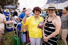 Two people smiling at the camera