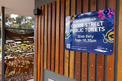 A sign for Coode Street Public toilets