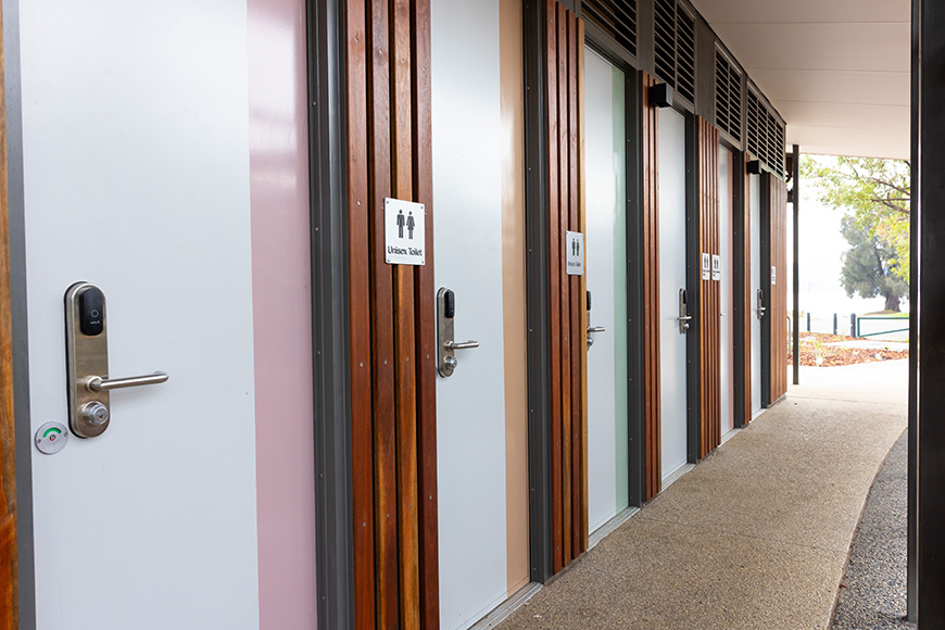 A row of doors for unisex toilets