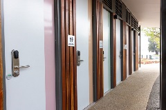 A row of doors for unisex toilets