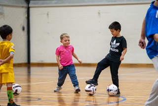 AclassofkidslearningsocceratGeorgeBurnettLeisureCentre