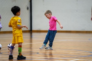 AclassofkidslearningsocceratGeorgeBurnettLeisureCentre