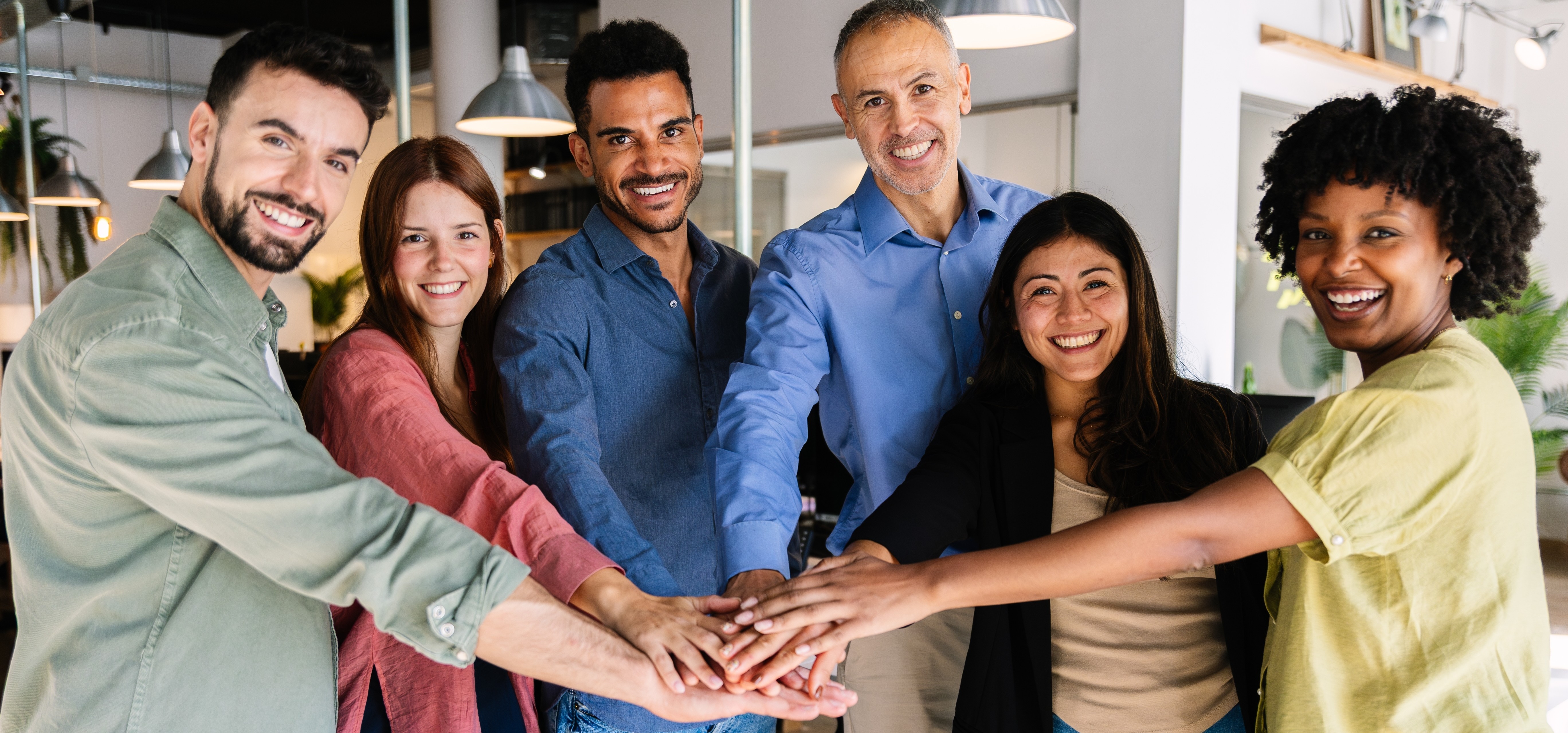 Diverse group of people smiling.