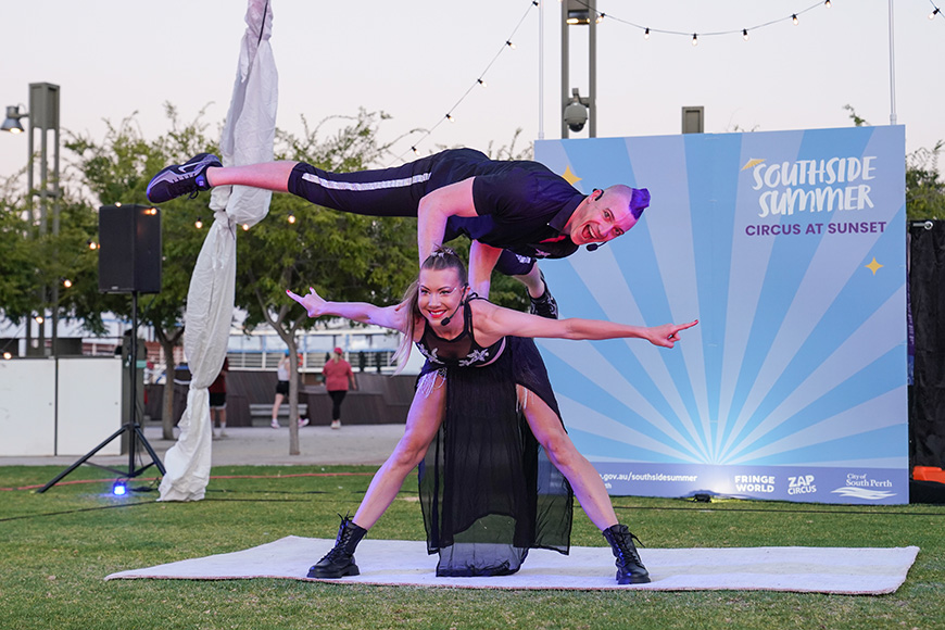 An acrobat balancing upon another acrobat