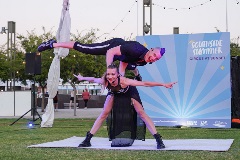 An acrobat balancing upon another acrobat