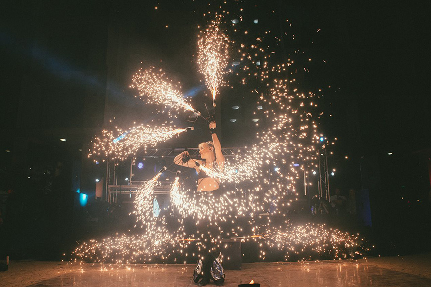 Someone swirling sparks around them