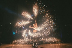 Someone swirling sparks around them