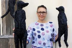 Artist Mikaela Castledine with meerkats 