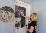 WomanplacesShopLocalSouthPerthstickeronherartiststudiowindow