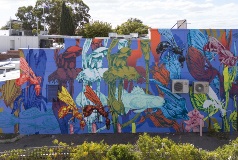 A wall mural of flora in abstract colours.