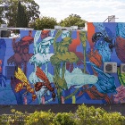 A wall mural of flora in abstract colours.