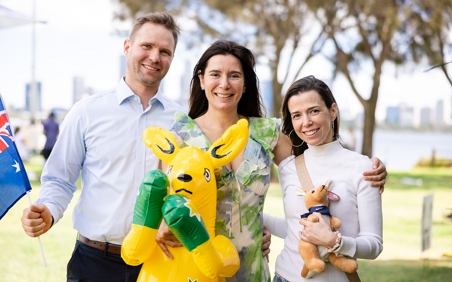 People smiling at camera with Australia Day merchandise