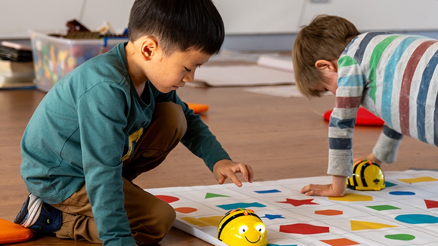 Childplayingwithrobotbee