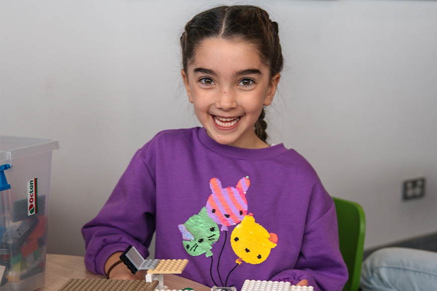 Girl playing with LEGO