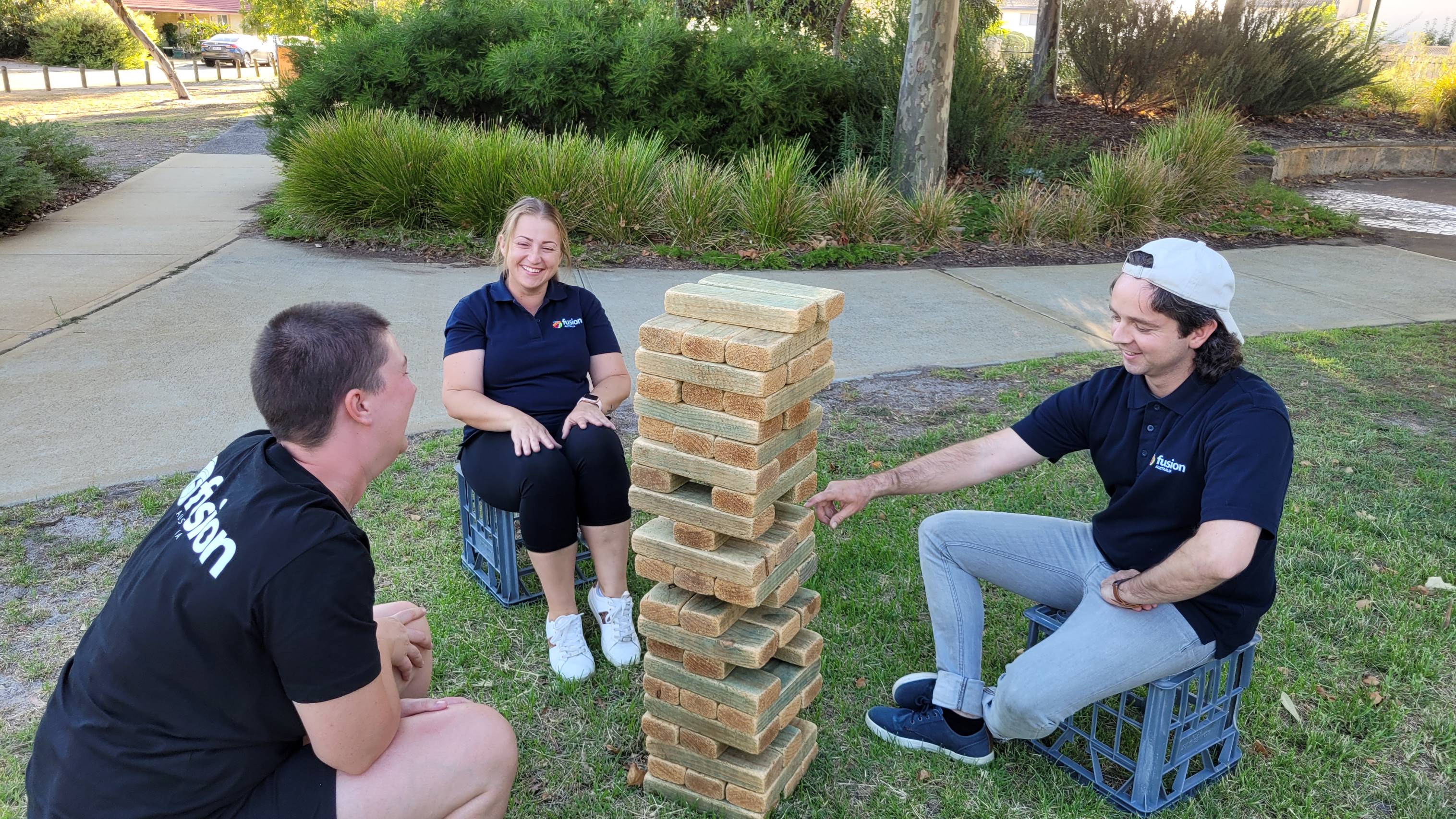 Three youth workers playing Jenga