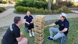 Three youth workers playing Jenga