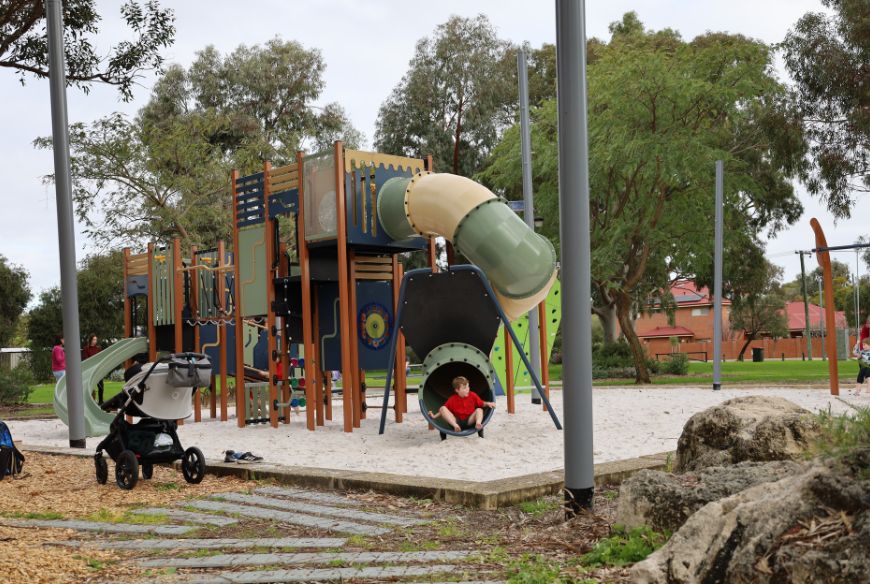 Children playing on new play equipment at Bill McGrath Reserve in Kensington