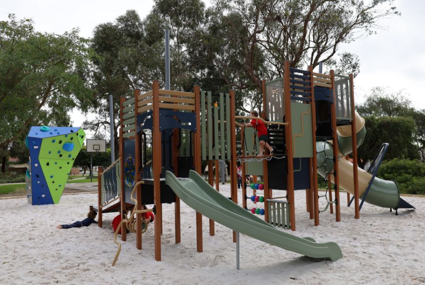 Children playing on new play equipment at Bill McGrath Reserve in Kensington