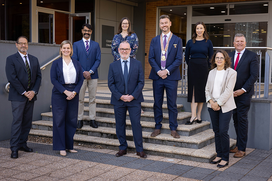 A group of people smiling,