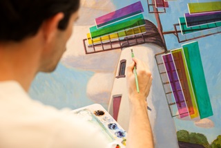 Manwithwhitepaintpaletteholdingapaintbrushtoacanvaspaintingofalighthouse