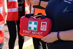 Aredfirstaidbagwithagreenandwhitecrossonit