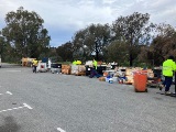 Cleanaway workers sorting collected hazardous household items