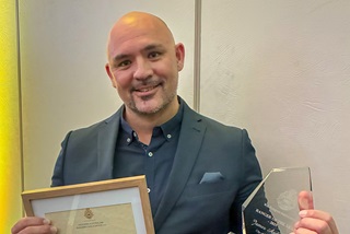 City Ranger holding Award