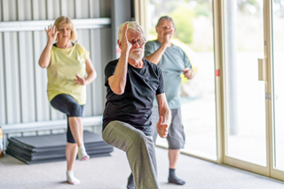 3peopleperformingataichiexerciseclass