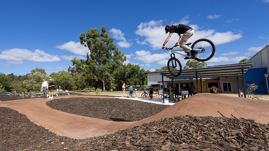 ImageofayoungmandoingaBMXtrickoverajumpportionoftheManningBikeTrackfacility