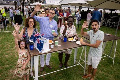 New citizens enjoying a sausage sizzle at the Big Aussie Breakfast