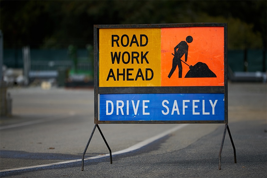 RoadsignthatsaysRoadWorkAhead-DriveSafely