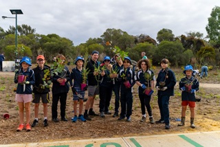 Childrenandteensholdingtreesreadyfortreeplanting