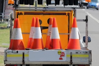 Trafficconesandsignsonthebackofaute