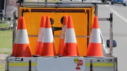 Trafficconesandsignsonthebackofaute