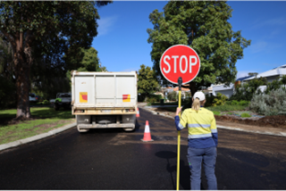 AcouncilworkerholdingaStopsign