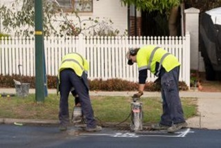 Roadworkersworkingonadrain
