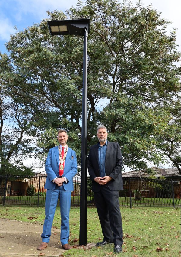 Mayor Greg Milner and Geoff Baker MLA, Member for South Perth, standing at one of the new lights in Karawara.