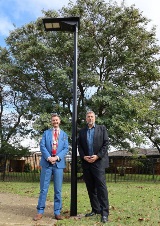 Mayor Greg Milner and Geoff Baker MLA, Member for South Perth, standing at one of the new lights in Karawara.