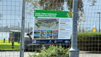 The temporary fencing at the Coode Street carpark with a sign about the project