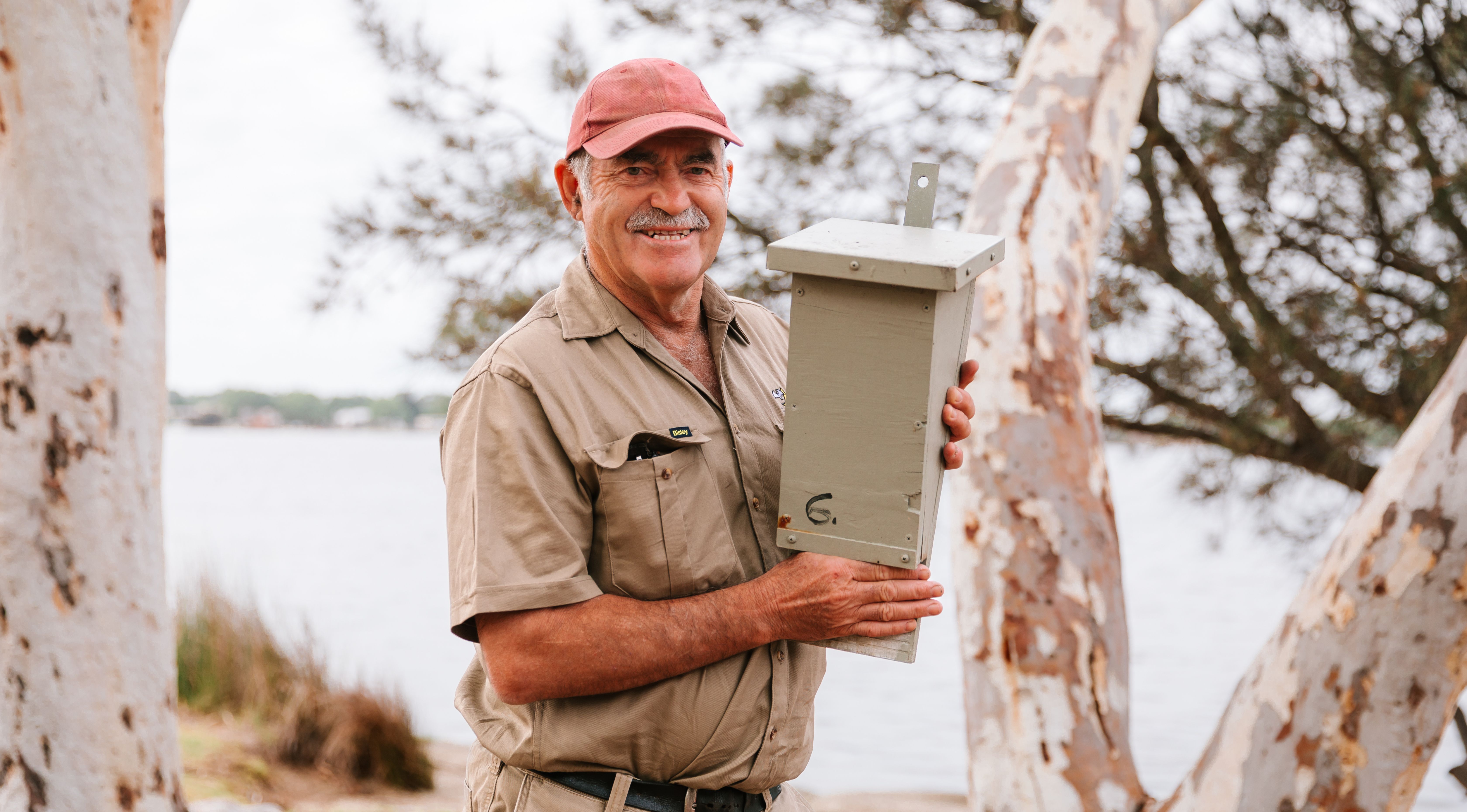 Joe Tonga holding a bat box
