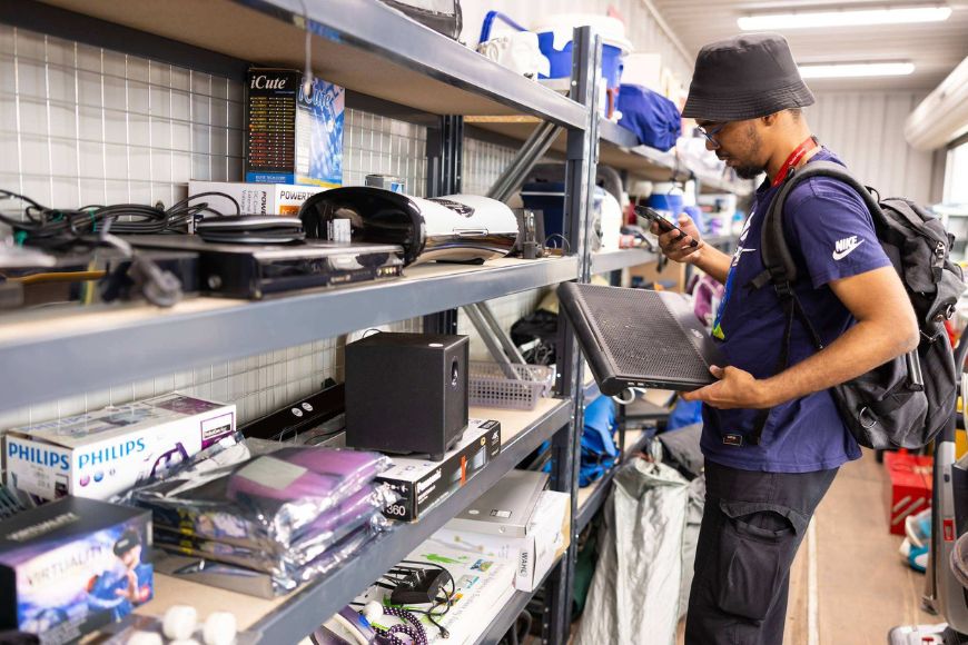 Man looking at second-hand electronics