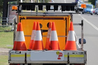 Trafficconesandsignsonthebackofaute