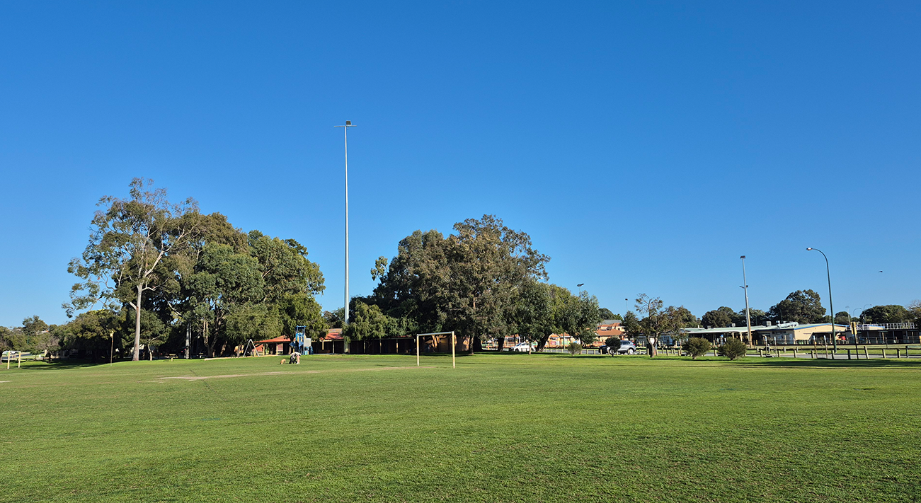 Oval in foreground and club buildings in background
